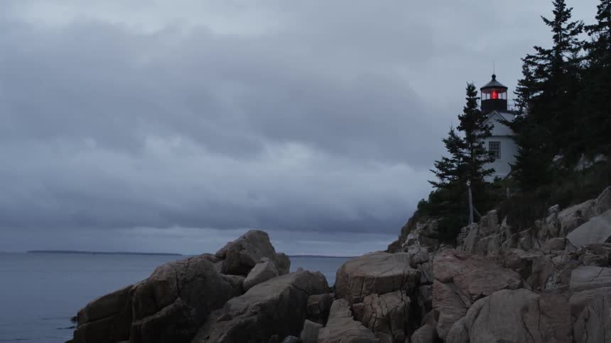 Looking over a rocky outcrop towards the ocean on an overcast day