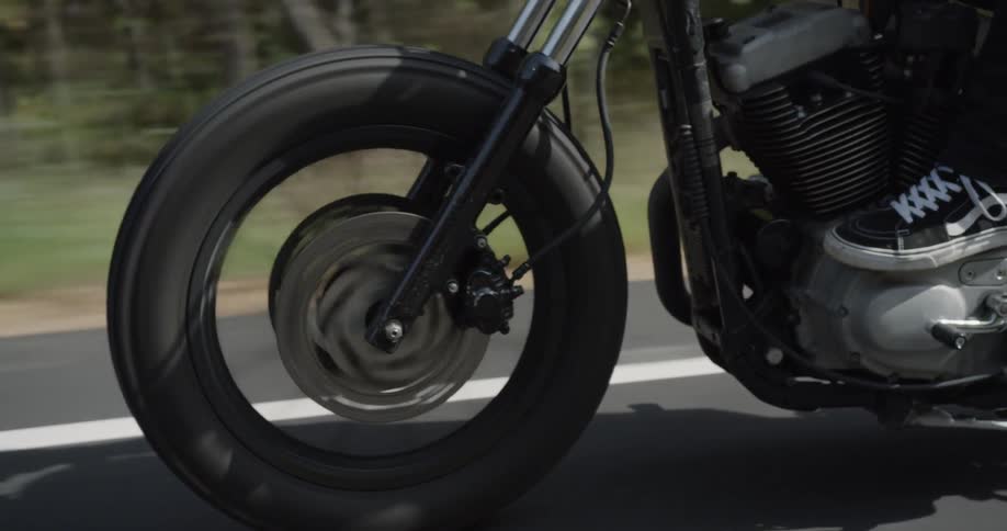 A motorcycle is driven on a rural road