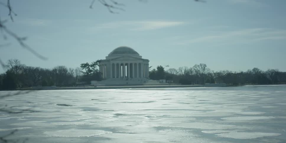 Large lake of ice in front of a white government building