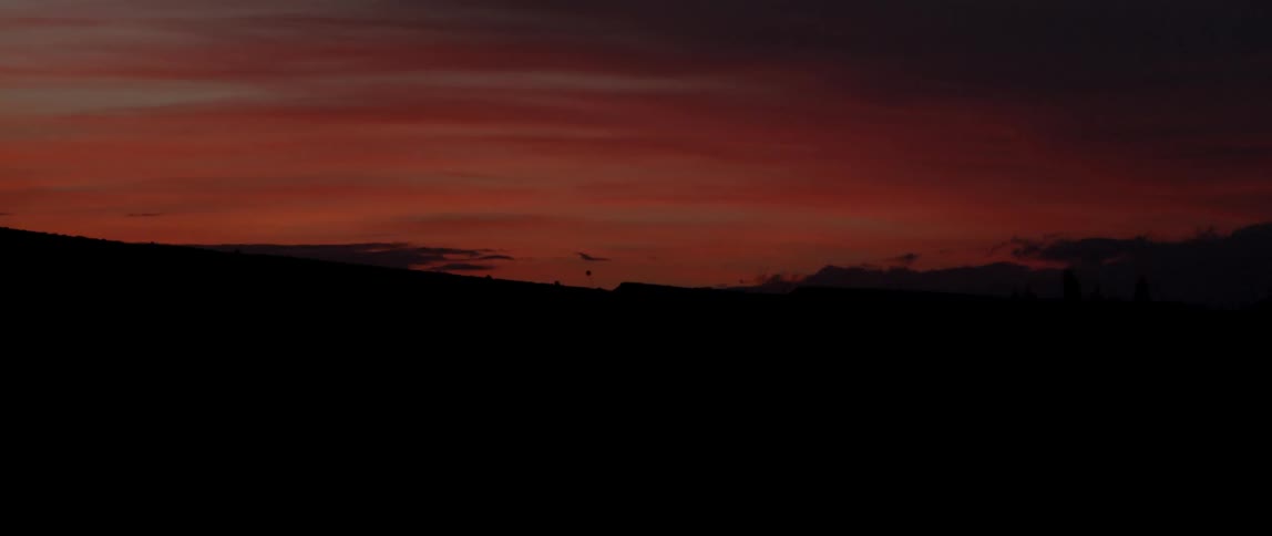 Desert in the night with a red sky