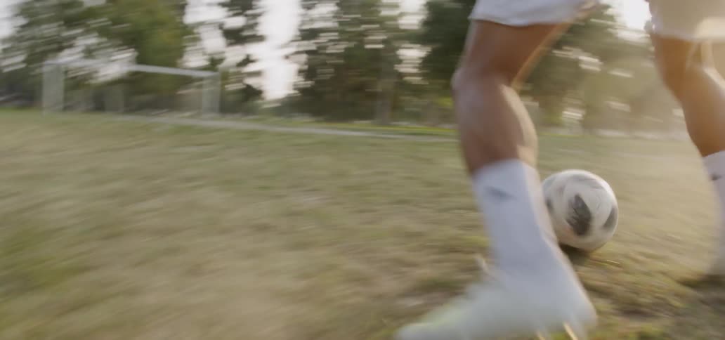 A young man plays soccer