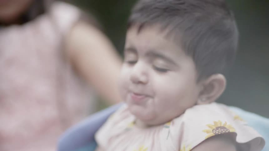 Baby on blanket in park