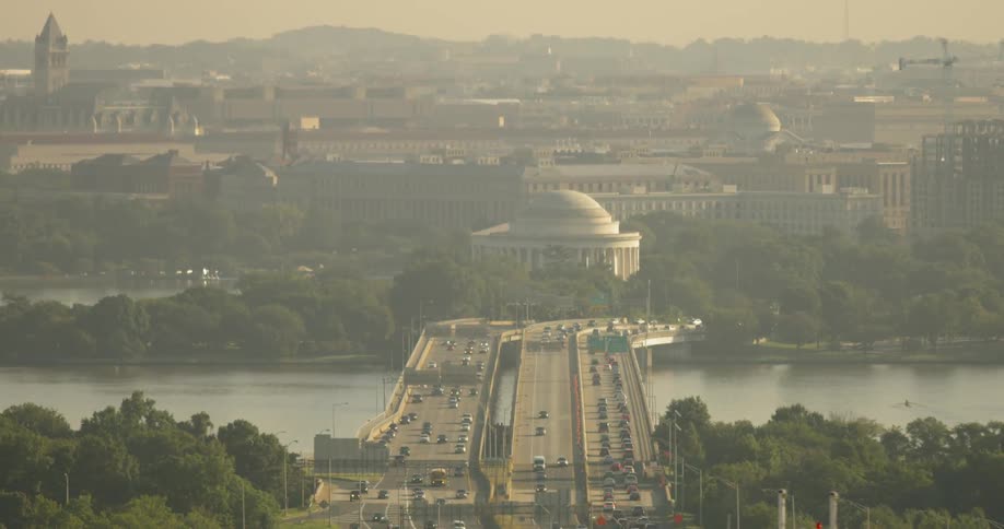 Cars pass over bridges near the jefferson memorial