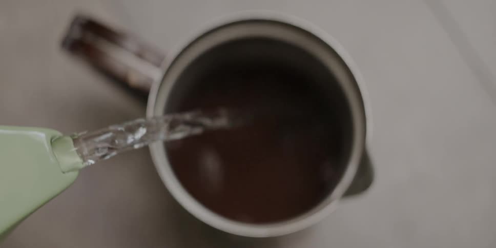 Water pouring into a mug