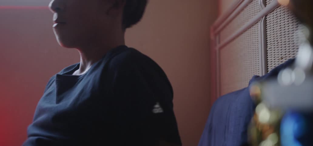 Young boy gets up from his bed