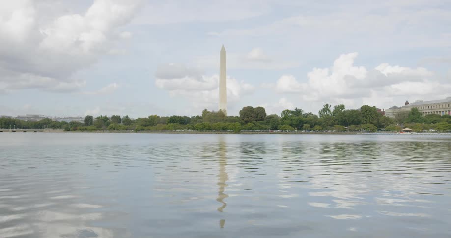 Water flows in a city with a tall tower nearby