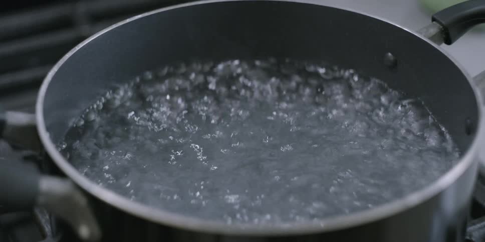 Water boils on a stovetop