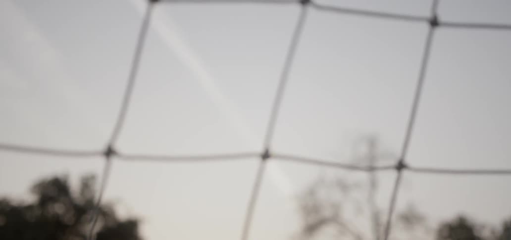 A net sits in a soccer field