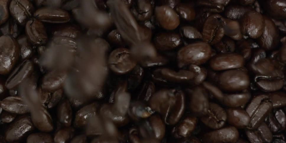 Coffee beans and falling into a pile