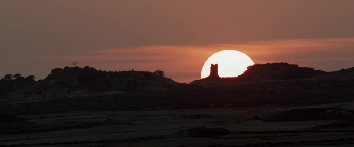 Sun is setting over the horizon in the wilderness