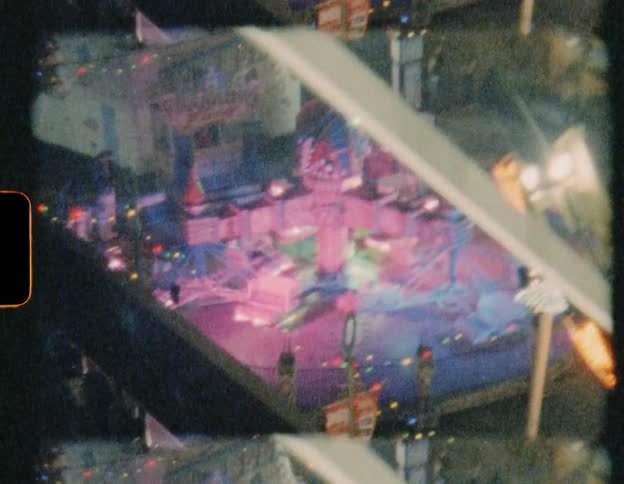 A scrambler spins around at the carnival