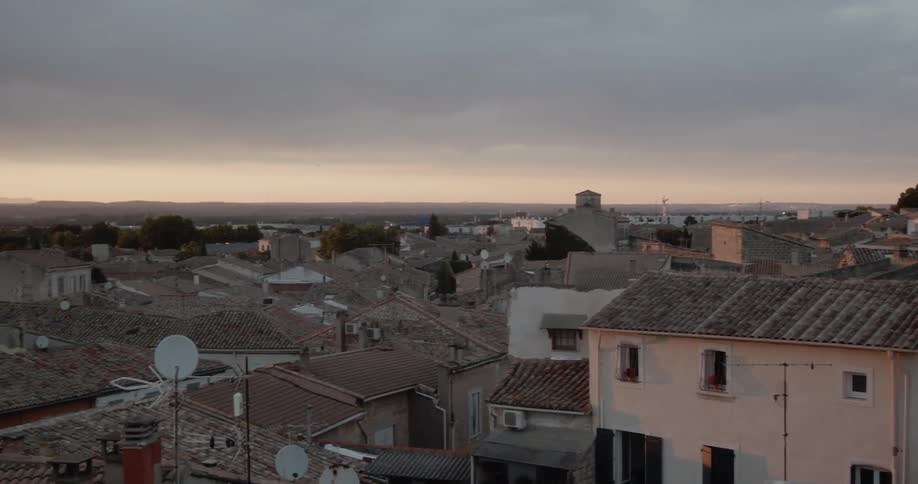 Brick buildings and homes in town on cloudy evening