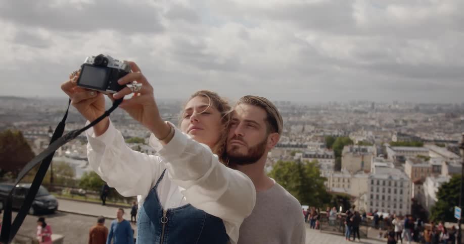 Woman takes selfie with boyfriend in Paris