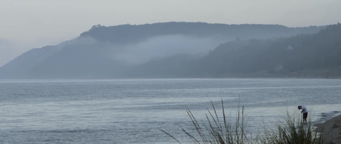 Mist floats above a mountain lake