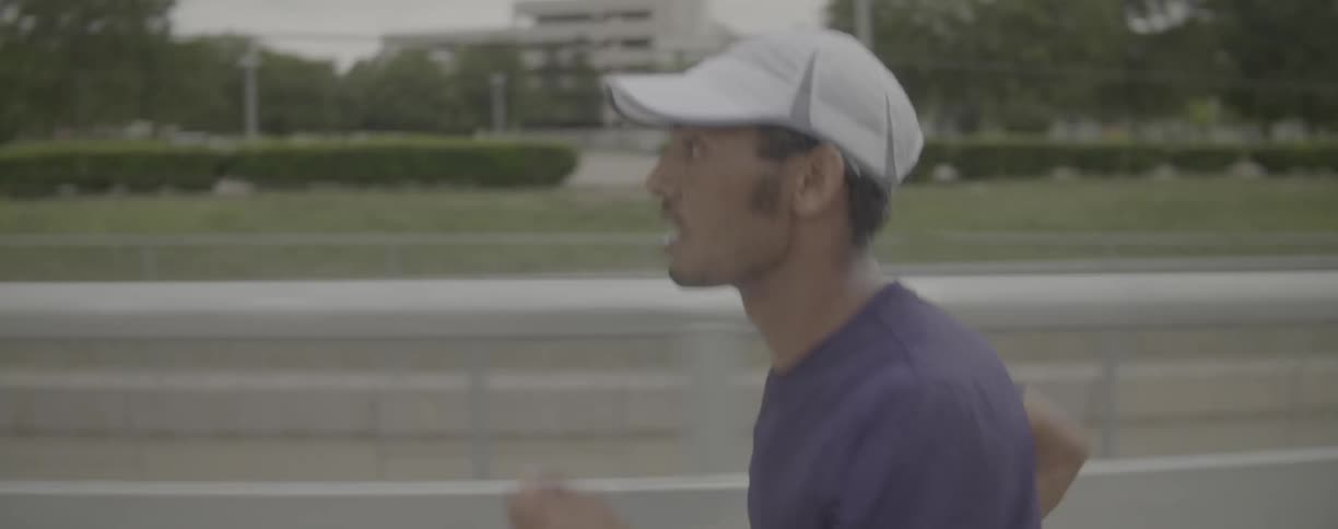 Man runs along a highway