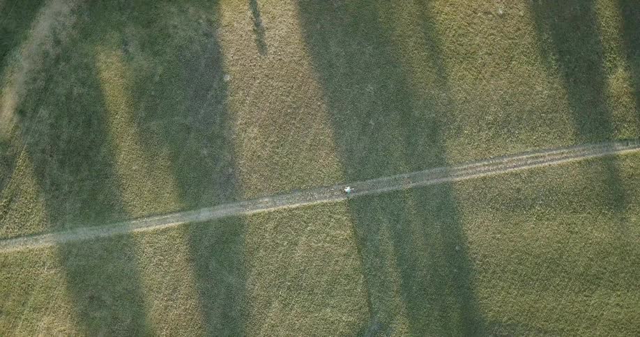 A runner jogs on a rural path