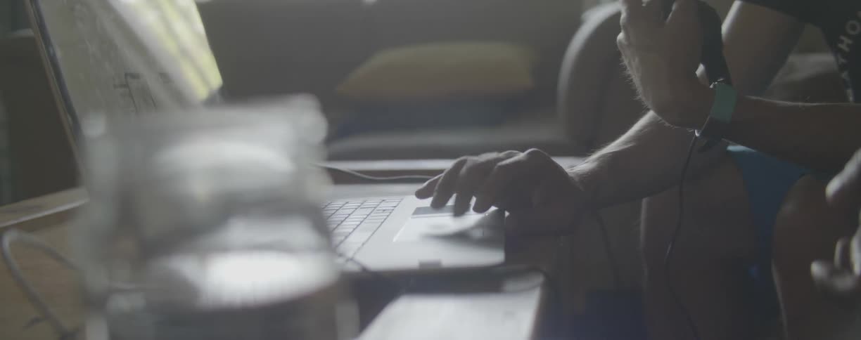 Man scrolls on the track pad on a laptop