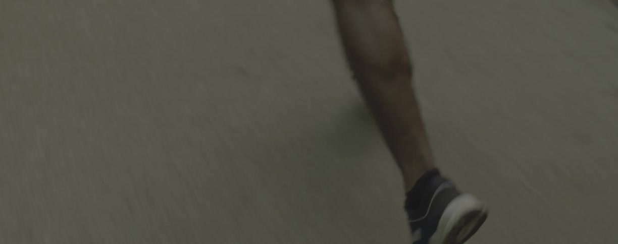 Person running on a sidewalk