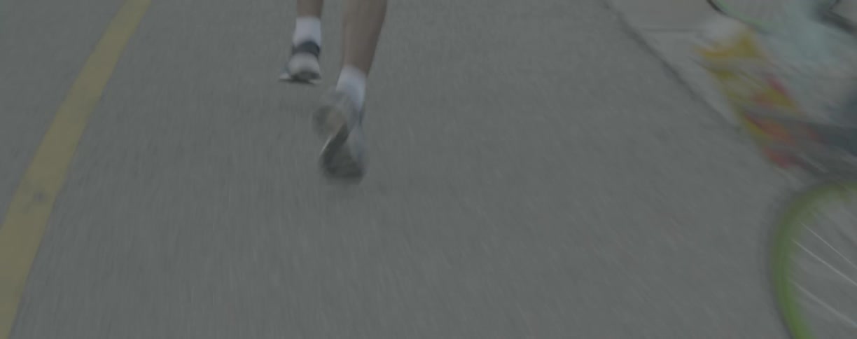 A man jogs down the street