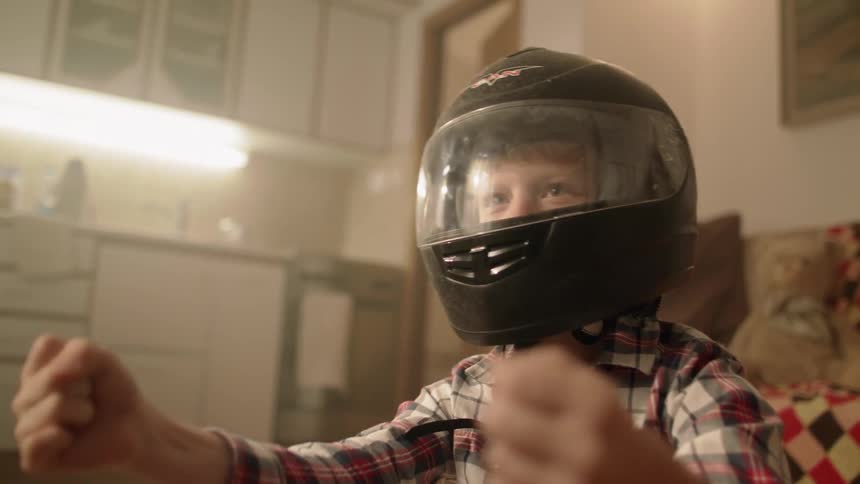 Young Boy Racing Next To Tv