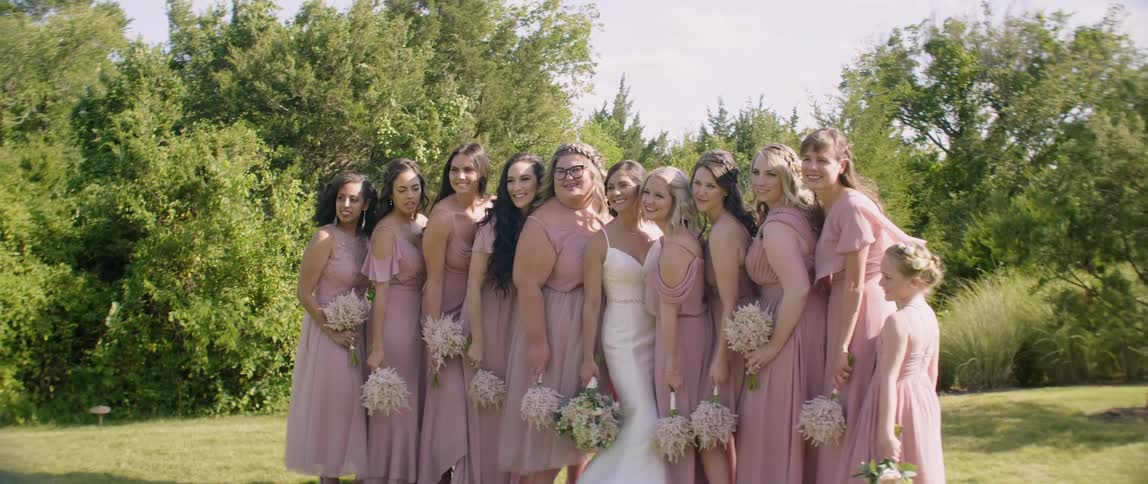 A bridal party poses for a picture