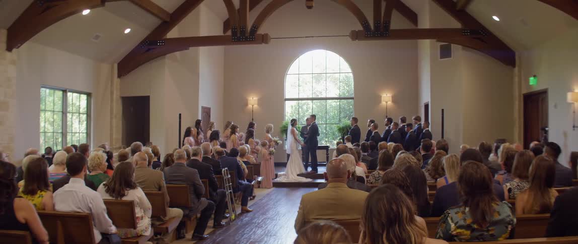 A bride and groom are married in front of wedding guests