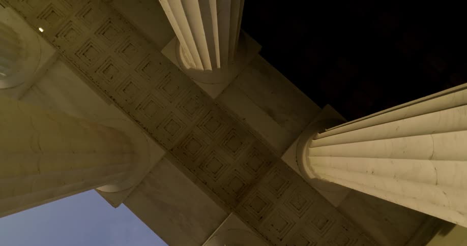 Stone building pillars tower overhead