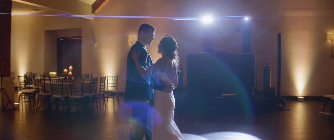 A bride and groom dance at their reception
