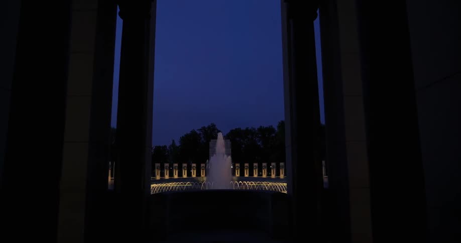 Fountains shoot water surrounded by lights