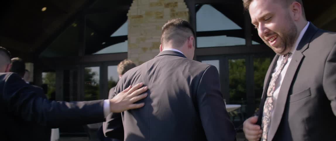 Groomsmen are gathered at a wedding
