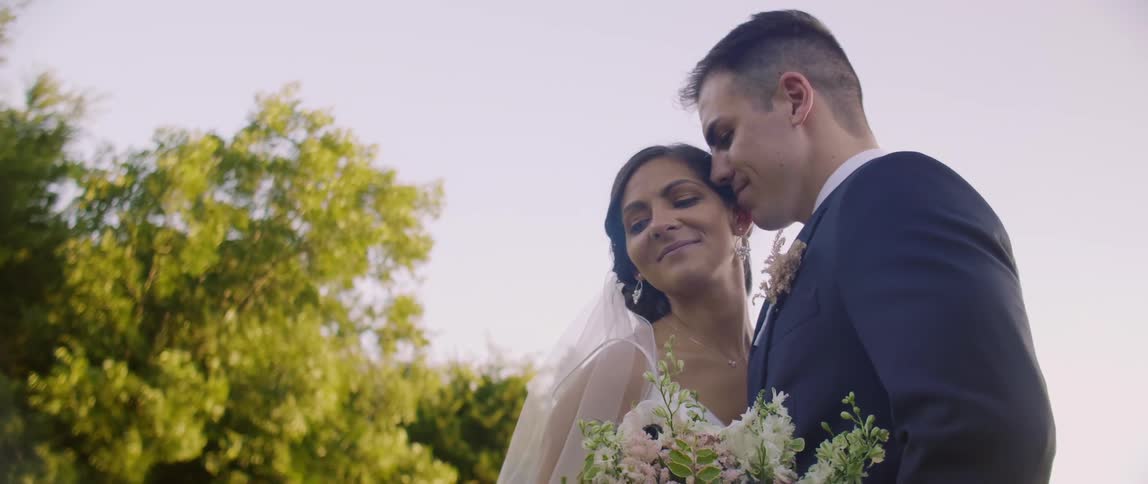 A bride and groom pose for photos