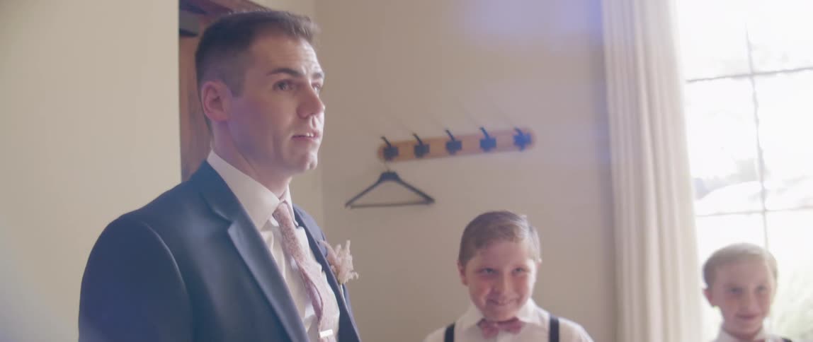 A man and boys are dressed for a wedding