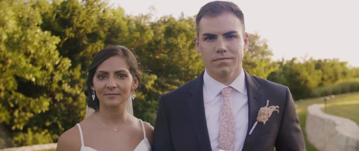 Bride and groom gaze forward