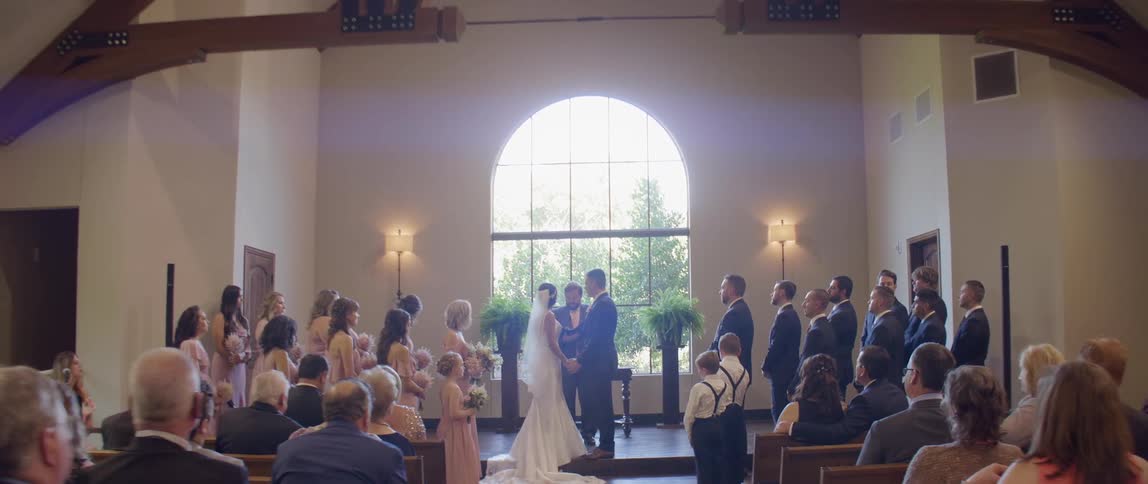 A bride and groom are married in front of wedding guests