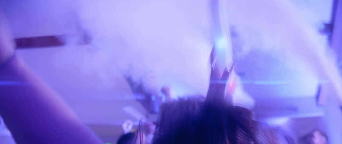 A crowd jumps up and down at a concert