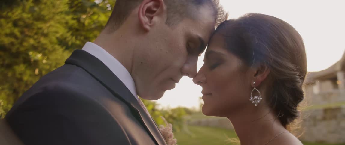 A bride and groom pose for photos