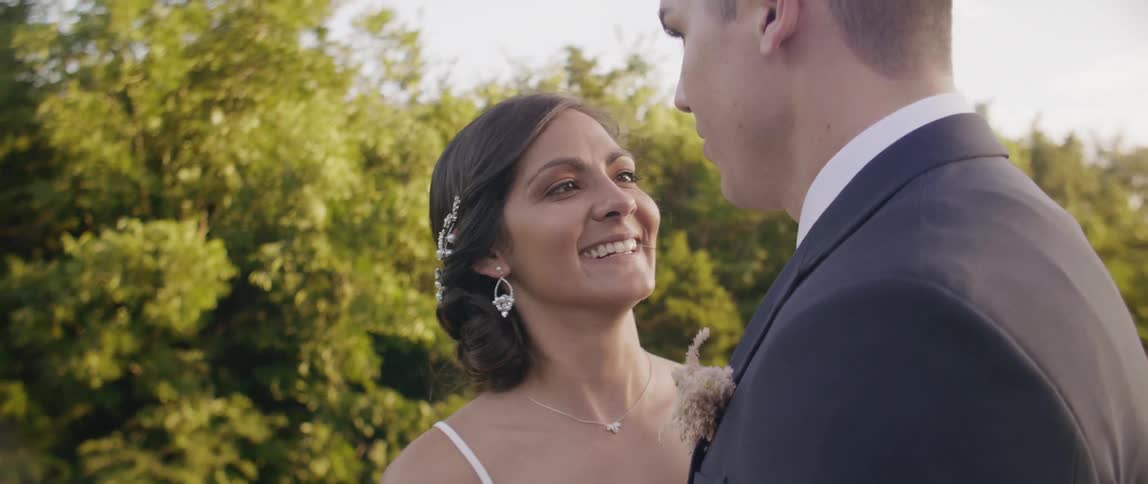 Bride and groom smile and talk