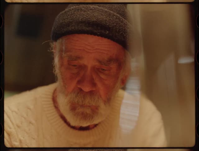 Elderly Man Living In Cabin