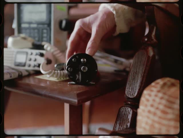 A fishing reel is set on a table