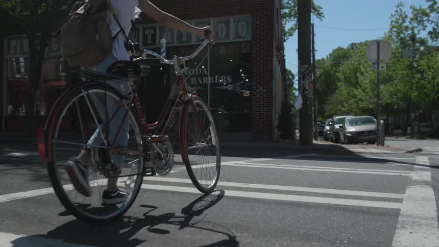 Photographer Riding Bike Around The City