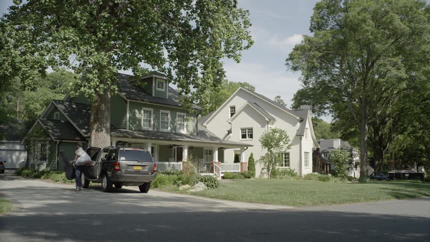 Man gets out of suv parked in driveway