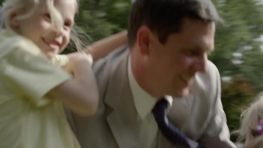 Kids run and greet their father