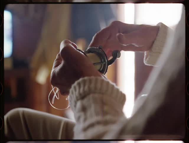 A man spins a fishing reel