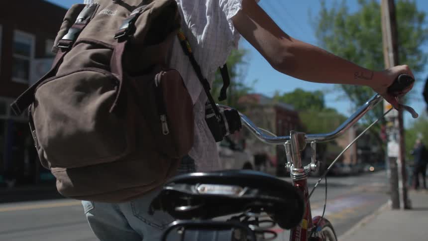 Photographer Riding Bike Around The City
