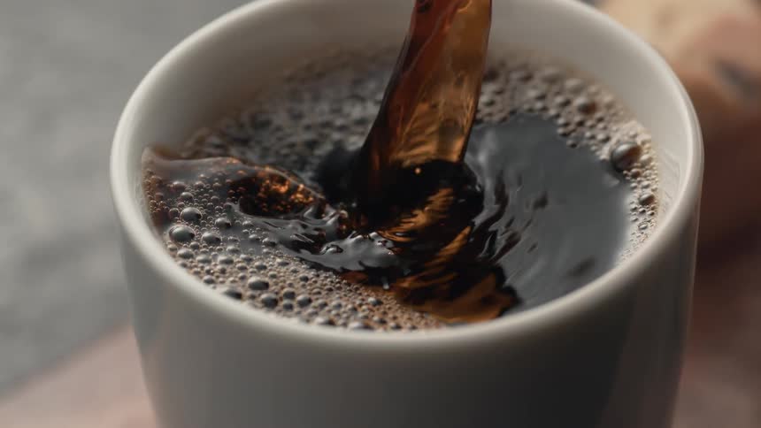 Coffee being poured into a cup