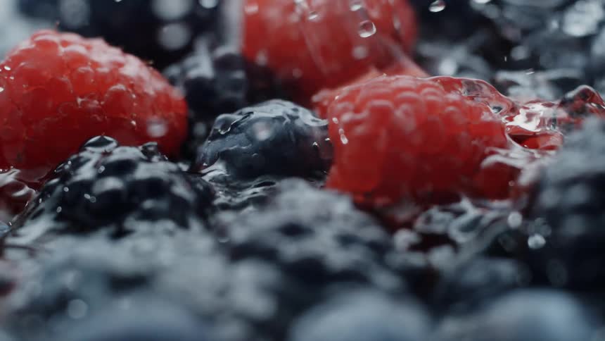 Water splashing onto fresh berries
