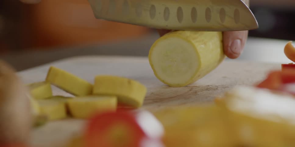 Chopping yellow squash