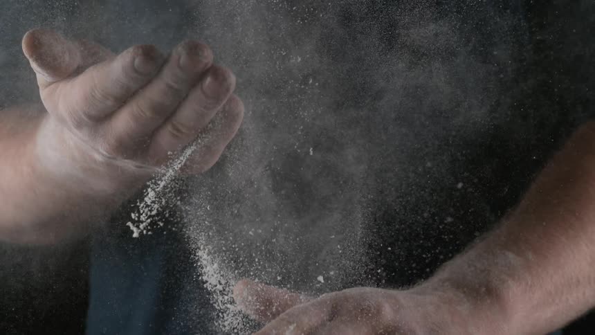 Flour in hands of chef