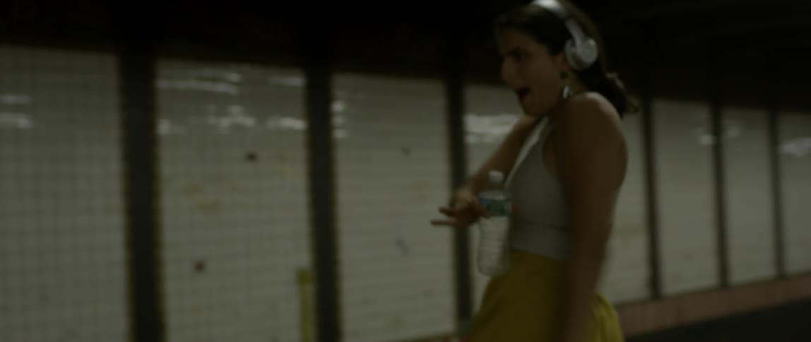 A woman dances in the subway