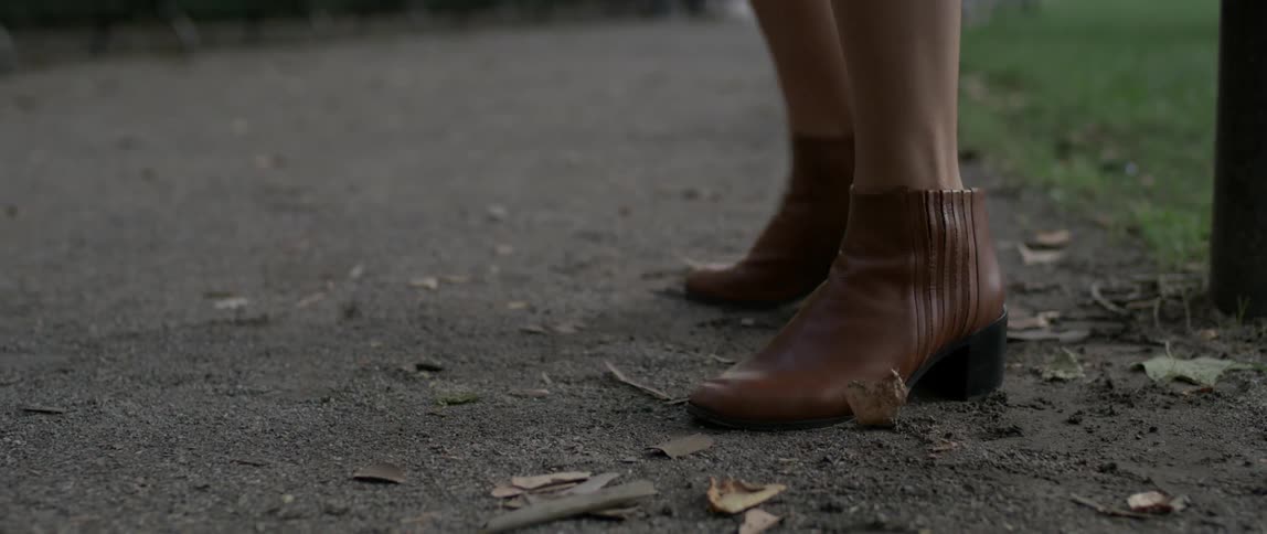 A woman dances in ankle boots